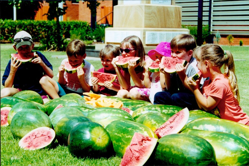 Children eating watermelon at the Chinchilla Melon Festival, 2001