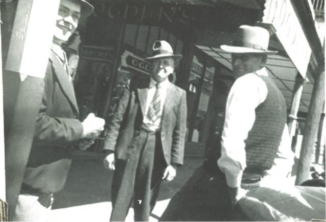 Unknown persons in front of E. J. Ogden's Drapers, Dalby, circa 1920