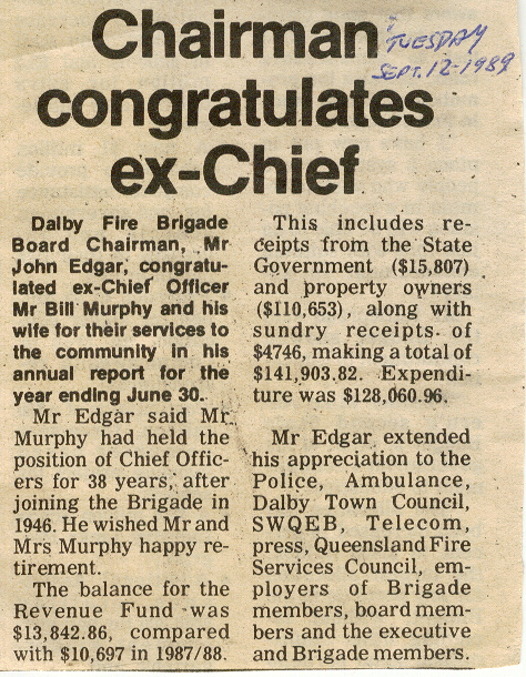 Chairman congratulates ex-Chief of Dalby Fire Brigade, 1989