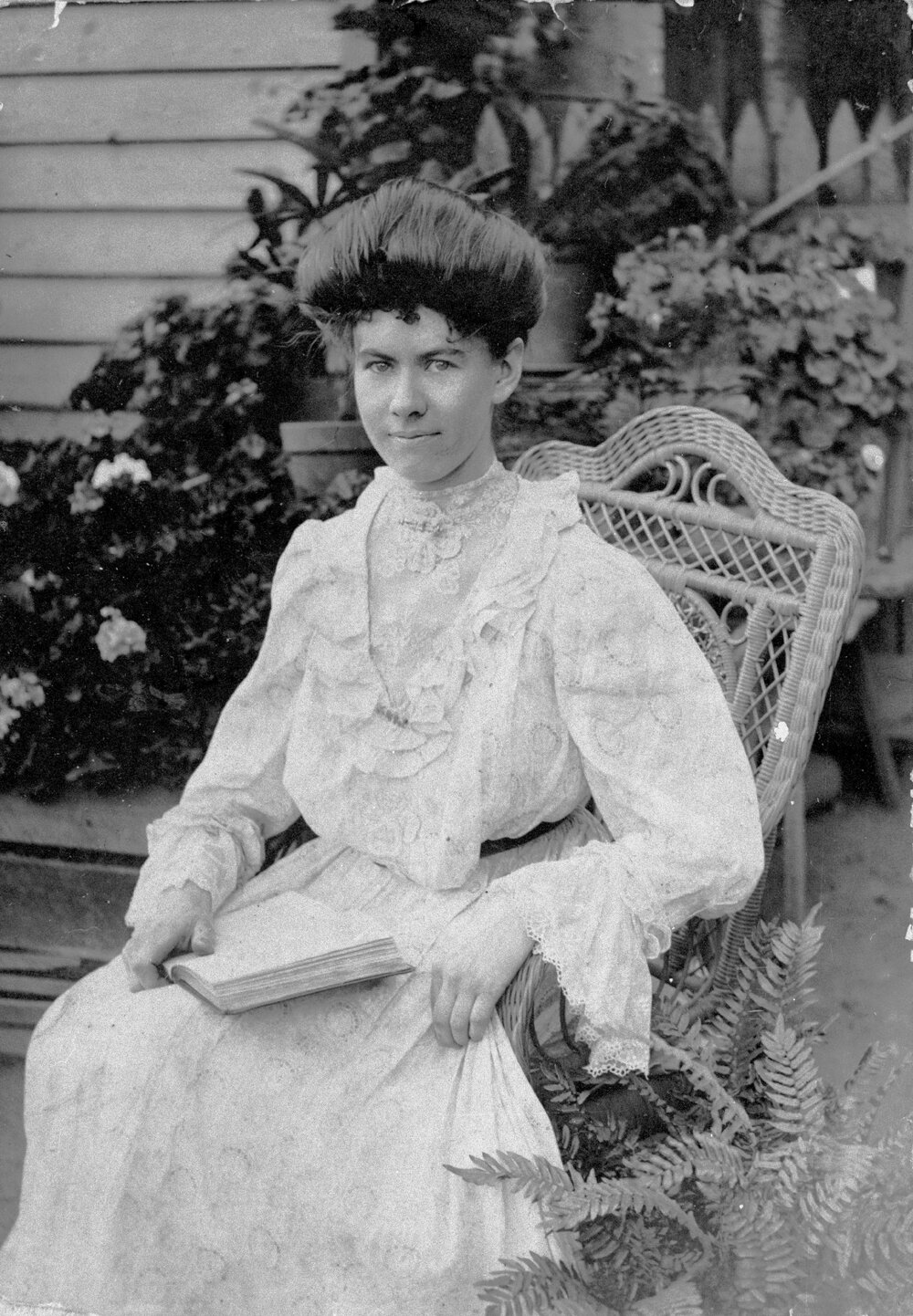 Lady sitting in a chair, no location, no date