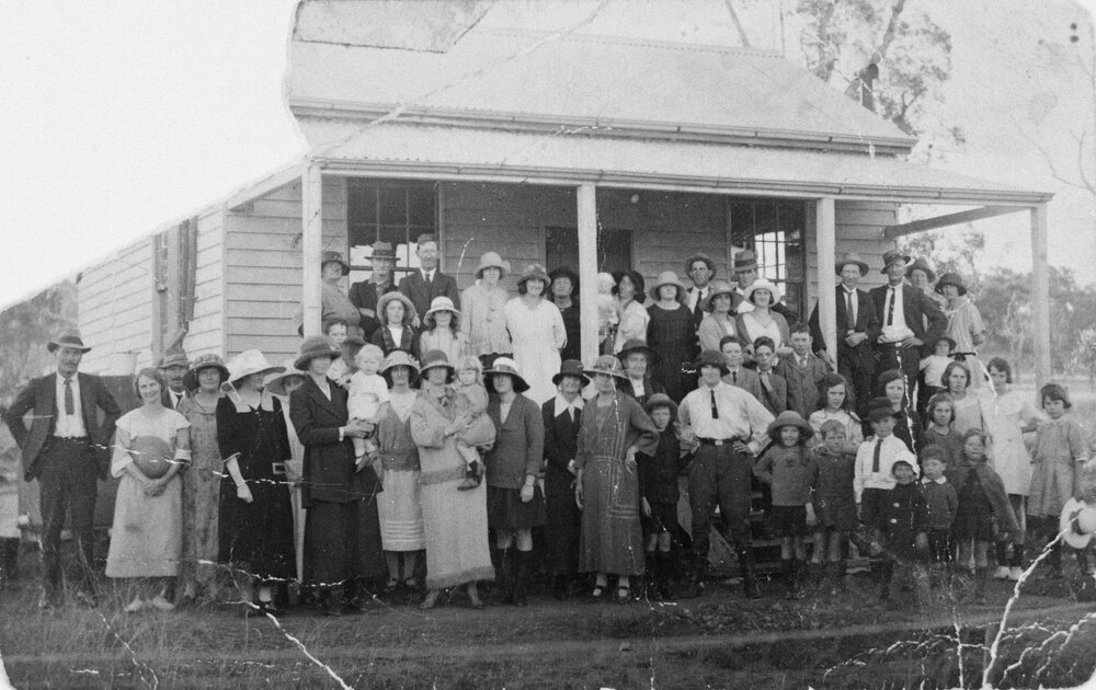 Group in front of a building, no location, no date