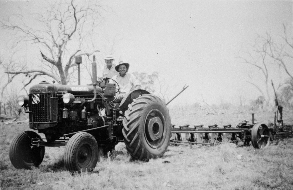 Two men on a tractor, no location, no date