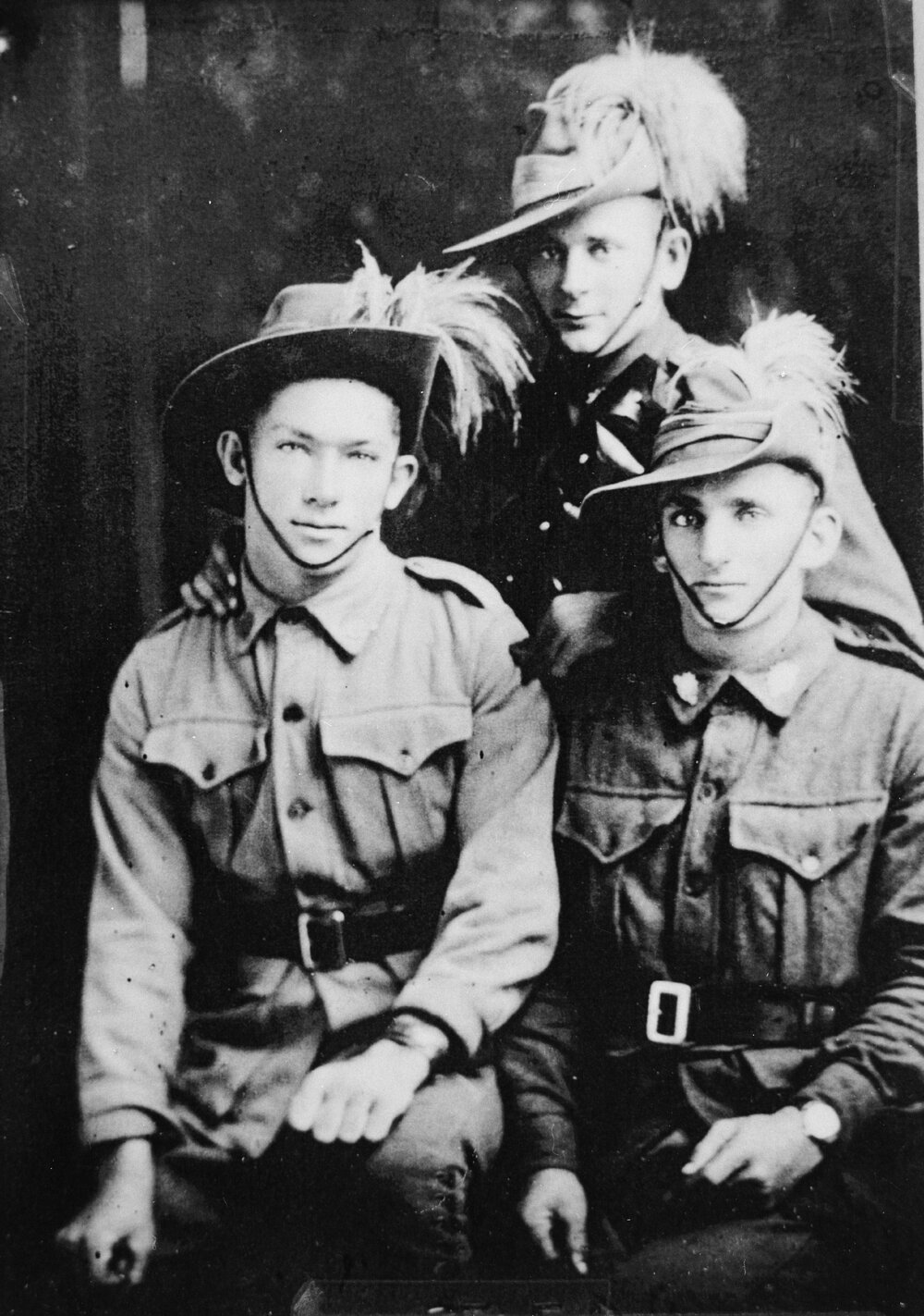 Three men in uniform, no location, no date