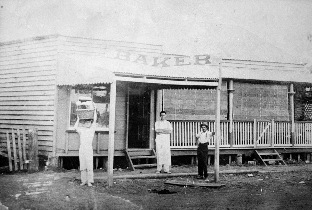 Three men outside Warra Bakery, Warra, circa 1910s