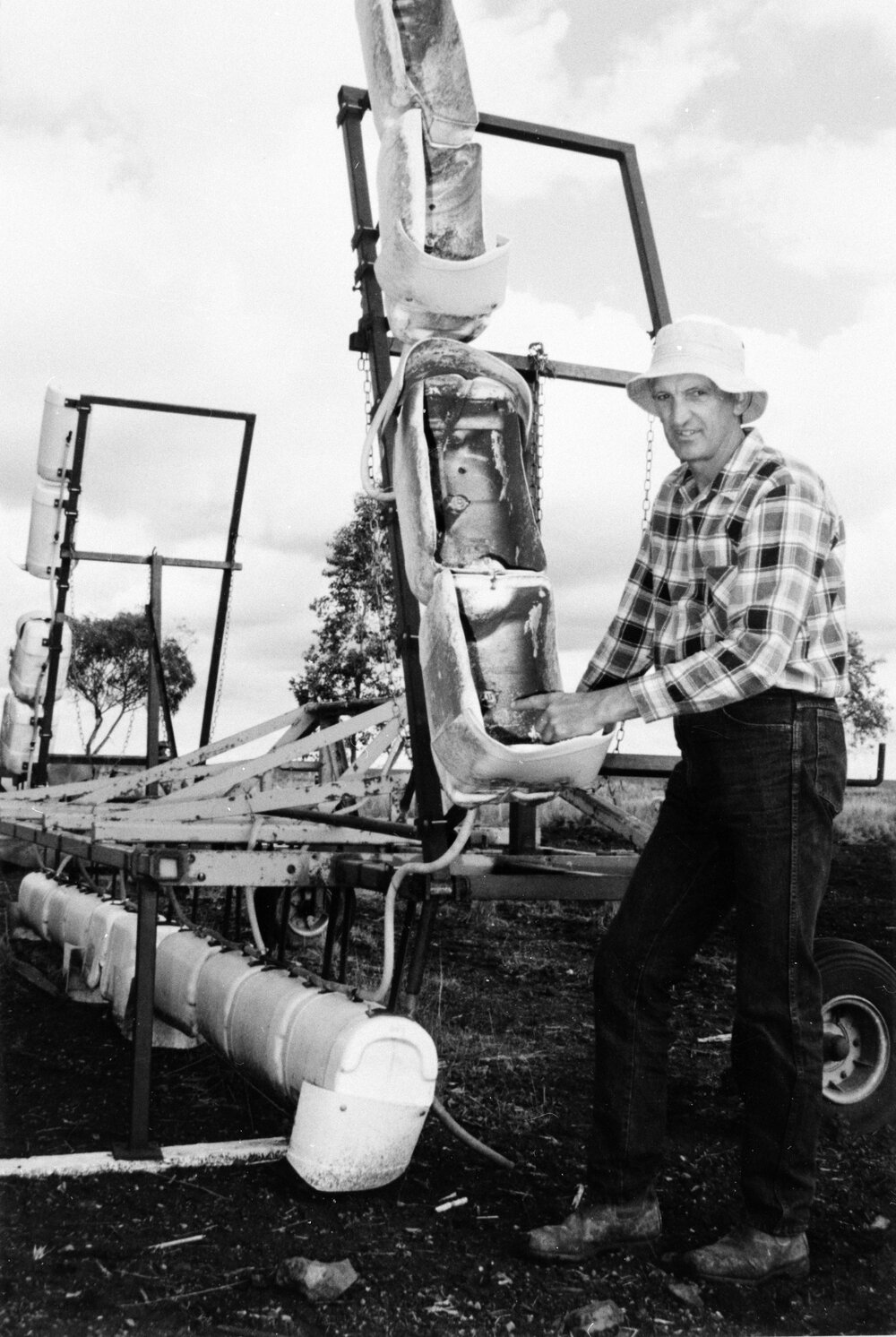 Neville Ronnfeldt with farm machinery, Pirrinuan, circa 1990s