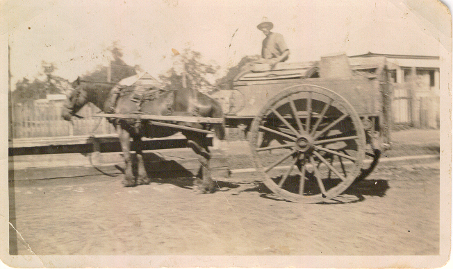 A horse and cart at a horse trough on Stuart Street, Dalby, 1926