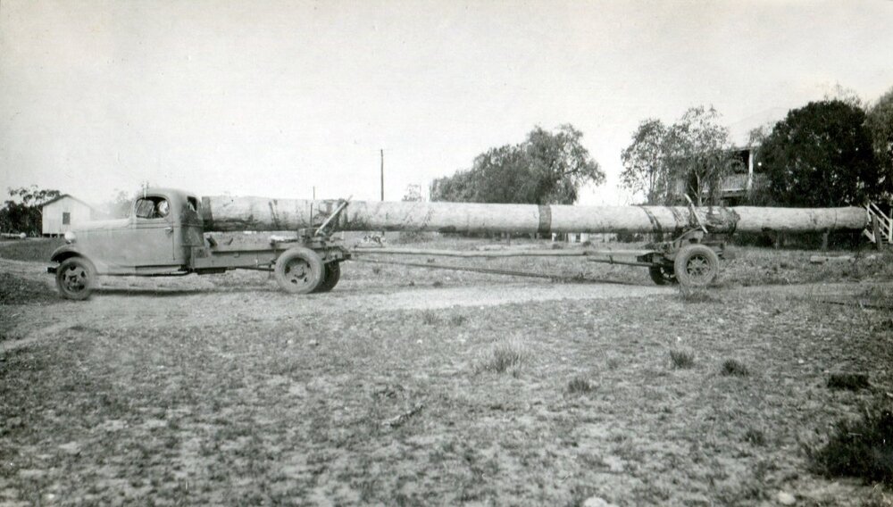 A Maple Leaf truck hauling a log into the railway yard at Guluguba, circa 1930s