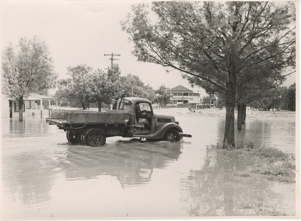Truck parked in floodwaters, Dalby, 1954