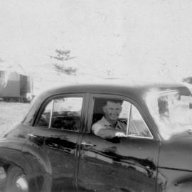 Man in a car, no location, no date