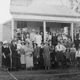 Group in front of a building, no location, no date