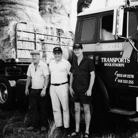 Three men beside a Shiells Transports truck, no location, no date