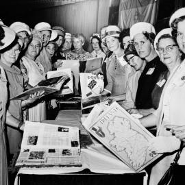 Ladies around a table, no location, no date