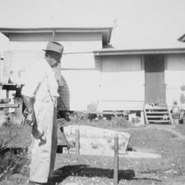 Man with a wheelbarrow, no location, no date