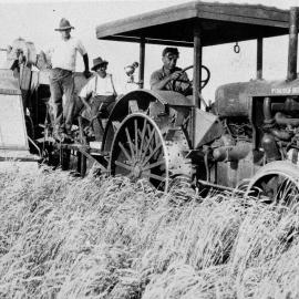 Three men on a tractor, no location, no date