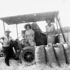 Bagging grain with the family, no location, no date
