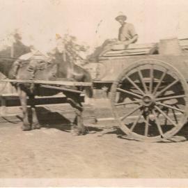 A horse and cart at a horse trough on Stuart Street, Dalby, 1926