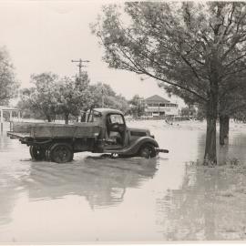 Truck parked in floodwaters, Dalby, 1954