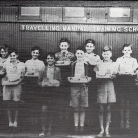 A group of students outside the Travelling Manual Training School, Jandowae, 1927