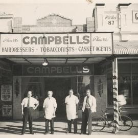 Four men standing in front of Campbells, Dalby, circa 1940